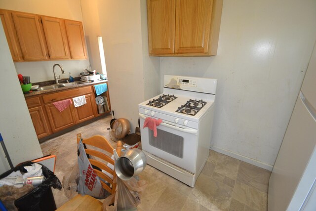 122 E 13th St, Covington, KY 41011 - kitchen with white gas range and refrigerator