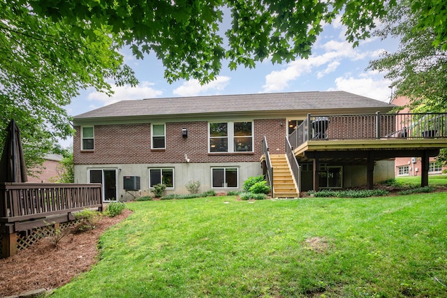 10234 Hempsteade Dr, Union, KY 41091 - back of house featuring stairway, a wooden deck, and a lawn