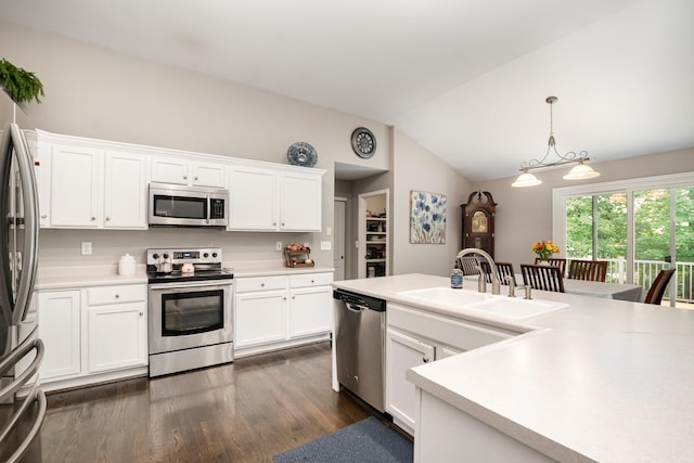 10234 Hempsteade Dr, Union, KY 41091 - kitchen with stainless steel appliances, vaulted ceiling, dark wood-type flooring, white cabinets, and light countertops