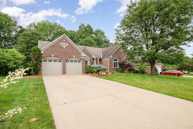 10234 Hempsteade Dr, Union, KY 41091 - view of front of home featuring brick siding, a garage, a front yard, and concrete driveway