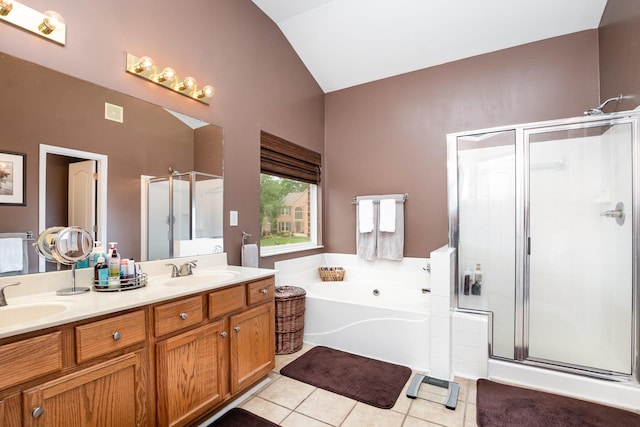 10234 Hempsteade Dr, Union, KY 41091 - bathroom featuring a stall shower, vaulted ceiling, tile patterned flooring, a bath, and double vanity