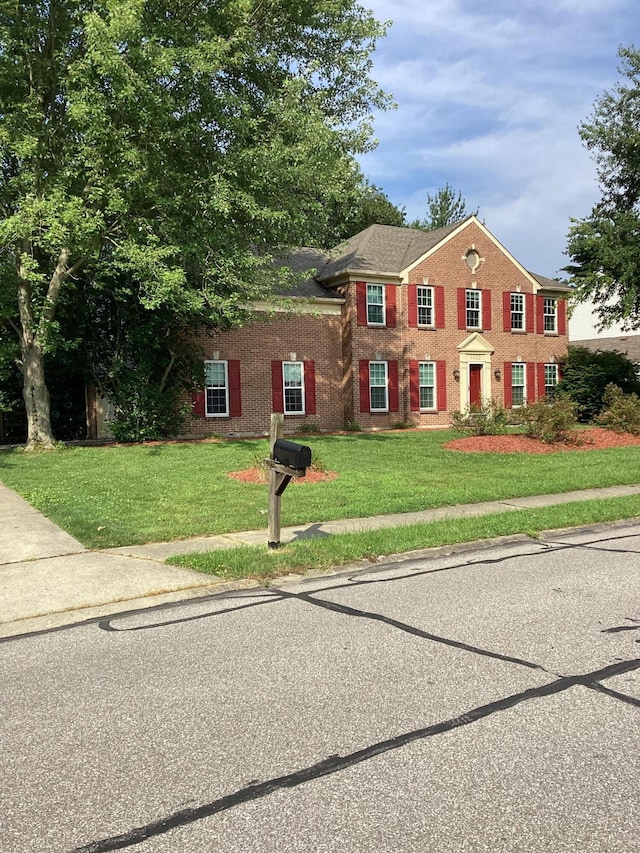 1033 Macintosh Ln, Florence, KY 41042 - colonial inspired home featuring brick siding and a front yard