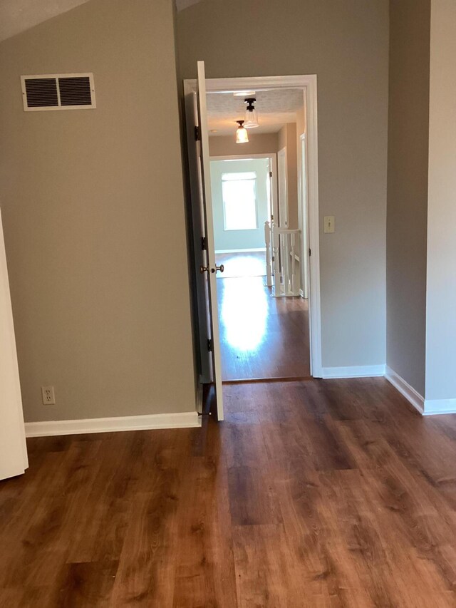 1033 Macintosh Ln, Florence, KY 41042 - empty room with dark wood-style flooring and vaulted ceiling