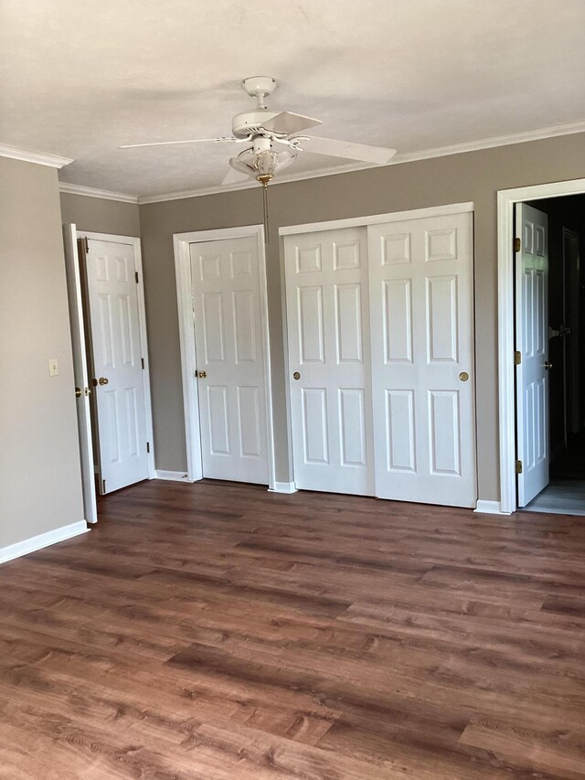 1033 Macintosh Ln, Florence, KY 41042 - unfurnished bedroom featuring crown molding, dark wood-type flooring, ceiling fan, and ensuite bath