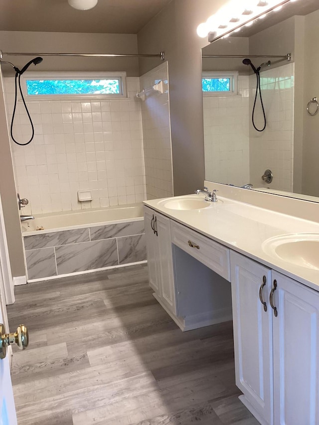1033 Macintosh Ln, Florence, KY 41042 - full bath with tiled shower / bath, double vanity, plenty of natural light, and wood finished floors