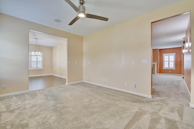 740 Norbie Dr, Burlington, KY 41005 - spare room featuring carpet flooring, a ceiling fan, and a chandelier