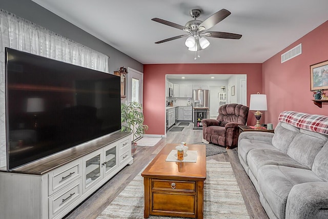 9070 Braxton Dr, Union, KY 41091 - living area with light wood-type flooring and a ceiling fan