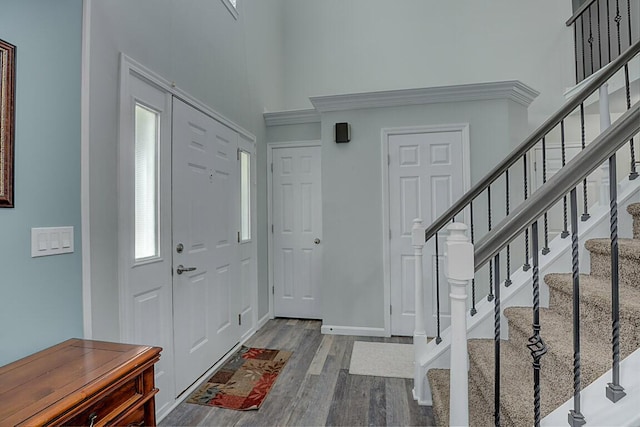 9070 Braxton Dr, Union, KY 41091 - foyer entrance with wood finished floors, stairs, and a high ceiling