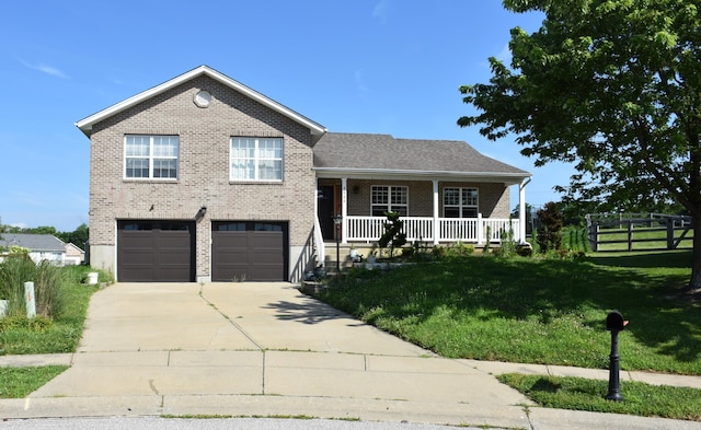6596 Elgin Ct, Burlington, KY 41005 - split level home with brick siding, a garage, a porch, and concrete driveway