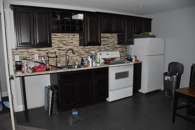 6596 Elgin Ct, Burlington, KY 41005 - kitchen featuring white appliances, tasteful backsplash, dark cabinets, and light countertops