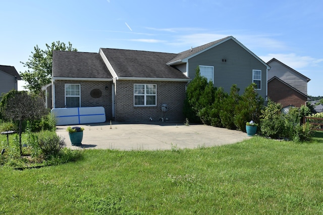 6596 Elgin Ct, Burlington, KY 41005 - rear view of house featuring a patio area, brick siding, a yard, and roof with shingles