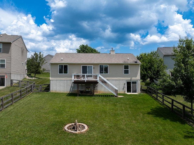 12229 Mashburn Dr, Walton, KY 41094 - rear view of house with stairs, a wooden deck, a fenced backyard, and a fire pit