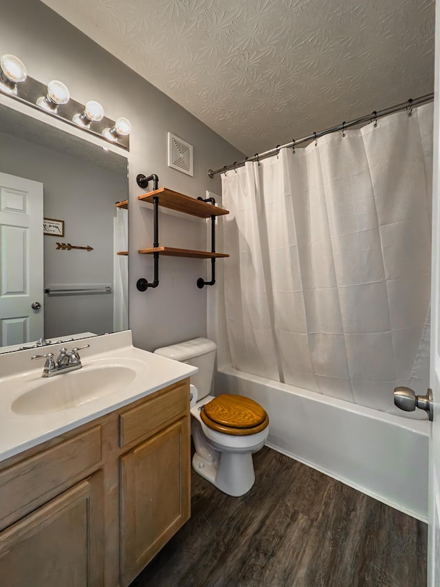 12229 Mashburn Dr, Walton, KY 41094 - bathroom featuring vanity, wood finished floors, shower / tub combo, and a textured ceiling