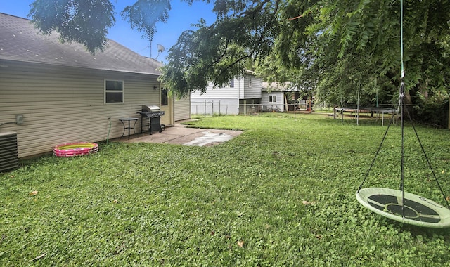 10239 Knob Hill Dr, Florence, KY 41042 - fenced backyard featuring a trampoline and a patio