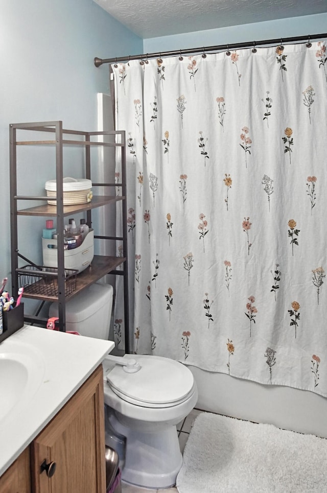 10239 Knob Hill Dr, Florence, KY 41042 - full bath with vanity, shower / bath combo with shower curtain, tile patterned flooring, and a textured ceiling