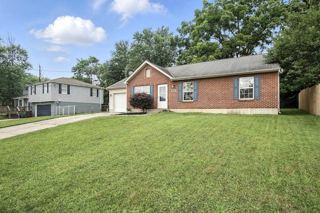 10239 Knob Hill Dr, Florence, KY 41042 - view of front of home featuring driveway, brick siding, a garage, and a shingled roof