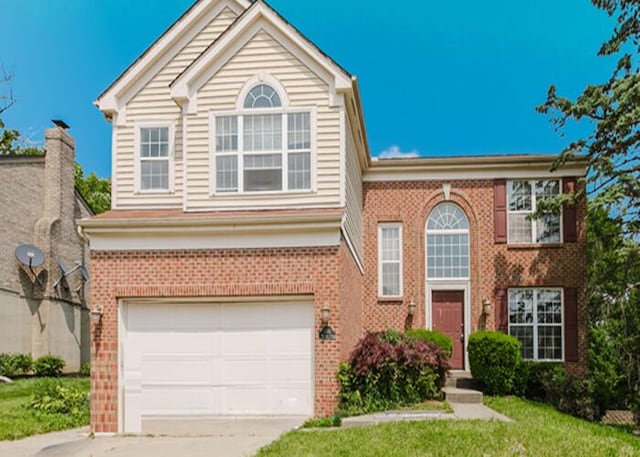 3310 Kingsburg Ct, Erlanger, KY 41018 - view of front of property featuring brick siding, driveway, an attached garage, and a front yard