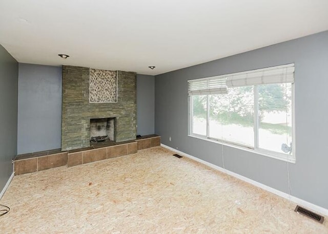 3310 Kingsburg Ct, Erlanger, KY 41018 - unfurnished living room featuring a tile fireplace and carpet