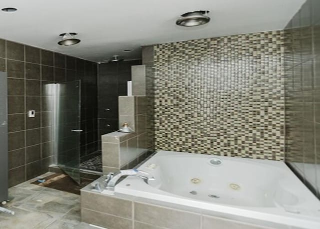 3310 Kingsburg Ct, Erlanger, KY 41018 - bathroom featuring a tub with jets and tiled shower