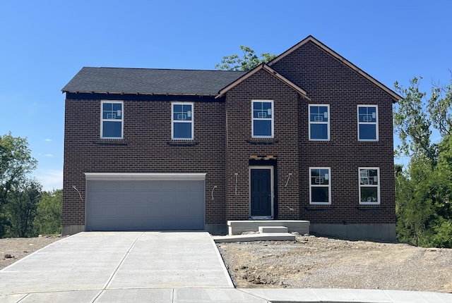 1843 Emory Ct, Hebron, KY 41048 - colonial house featuring driveway, an attached garage, and brick siding