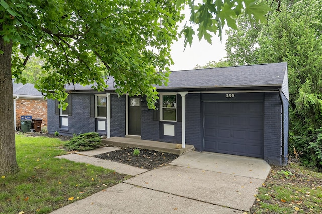 139 Berkley Dr, Florence, KY 41042 - ranch-style home featuring an attached garage, brick siding, driveway, and a shingled roof