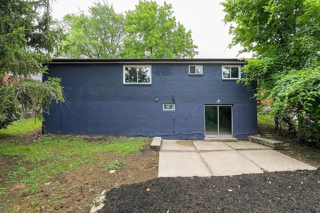 139 Berkley Dr, Florence, KY 41042 - rear view of house featuring a patio area and brick siding