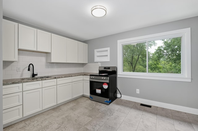 139 Berkley Dr, Florence, KY 41042 - kitchen featuring electric range, decorative backsplash, stone counters, and white cabinets