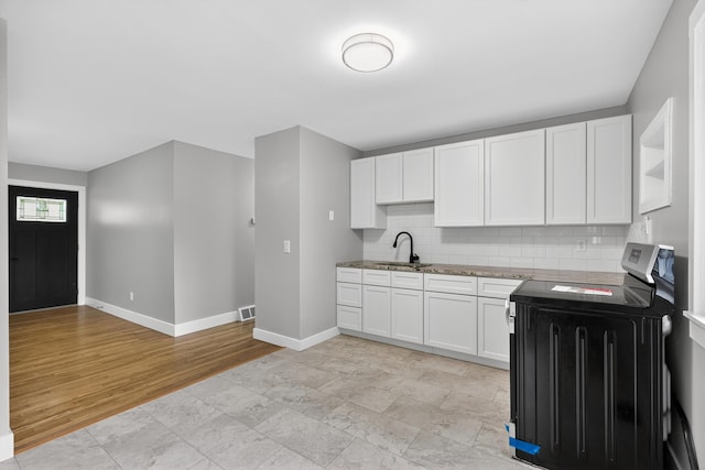 139 Berkley Dr, Florence, KY 41042 - kitchen with stainless steel range with electric cooktop, decorative backsplash, and white cabinetry