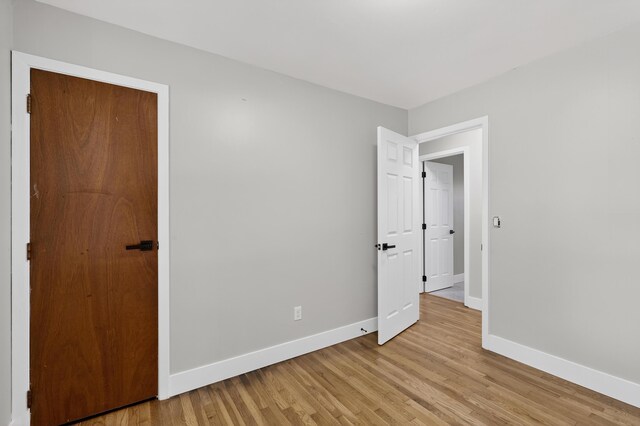 139 Berkley Dr, Florence, KY 41042 - unfurnished bedroom with baseboards and light wood finished floors