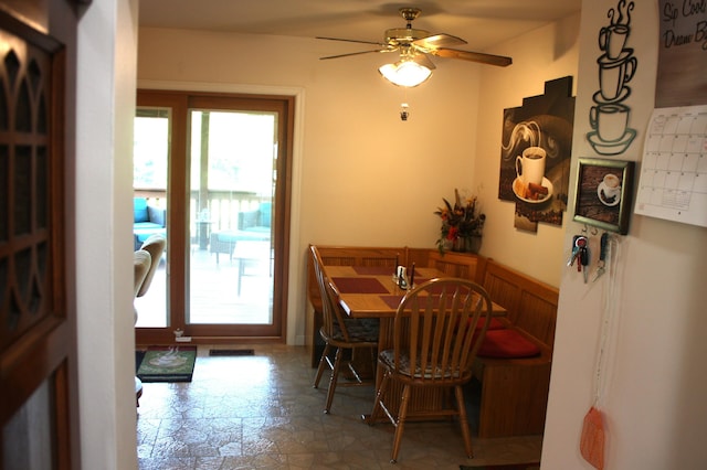 6065 Tosha Dr, Burlington, KY 41005 - dining room featuring ceiling fan and a wainscoted wall