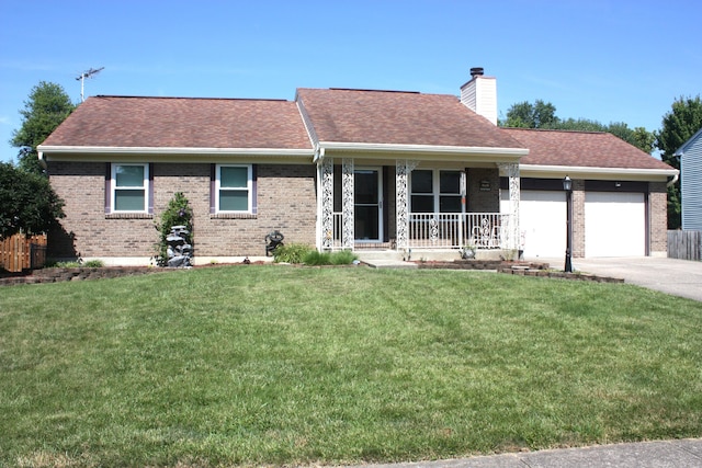 6065 Tosha Dr, Burlington, KY 41005 - view of front facade with a porch, brick siding, an attached garage, a chimney, and a front lawn