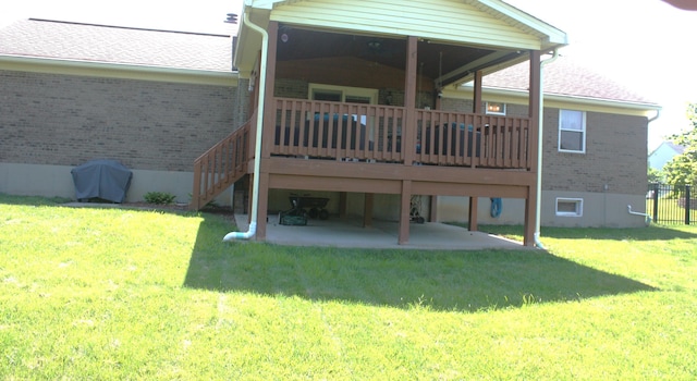 6065 Tosha Dr, Burlington, KY 41005 - back of property featuring brick siding, a patio, a wooden deck, and stairs