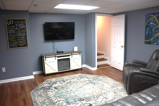 6065 Tosha Dr, Burlington, KY 41005 - living area featuring a drop ceiling, dark wood-style floors, and stairs