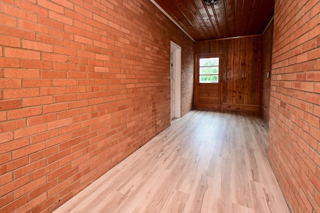 680 Manor Dr, Taylor Mill, KY 41015 - empty room with wood finished floors, brick wall, and wooden ceiling