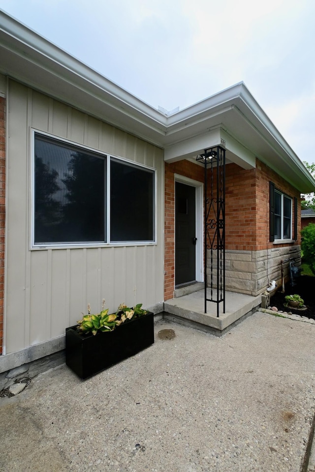 680 Manor Dr, Taylor Mill, KY 41015 - property entrance featuring board and batten siding and brick siding