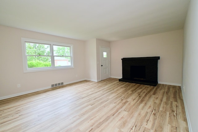 680 Manor Dr, Taylor Mill, KY 41015 - unfurnished living room featuring wood finished floors and a fireplace