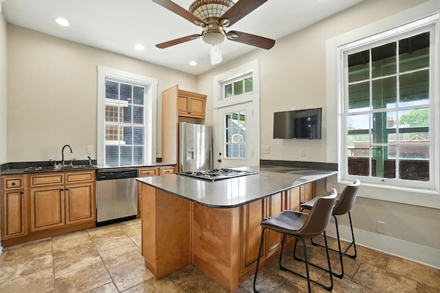 234 Walnut St, Bellevue, KY 41073 - kitchen featuring appliances with stainless steel finishes, brown cabinetry, healthy amount of natural light, a ceiling fan, and recessed lighting