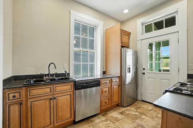 234 Walnut St, Bellevue, KY 41073 - kitchen featuring appliances with stainless steel finishes, dark countertops, brown cabinets, and recessed lighting