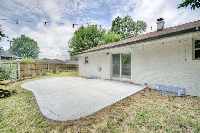 693 Peach Tree Ln, Erlanger, KY 41018 - rear view of property featuring brick siding, a patio, and a chimney