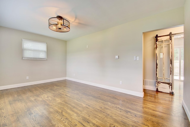 693 Peach Tree Ln, Erlanger, KY 41018 - empty room with wood finished floors and baseboards