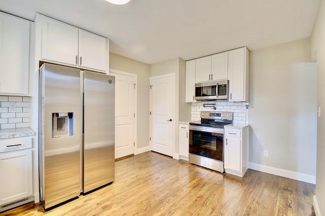693 Peach Tree Ln, Erlanger, KY 41018 - kitchen with stainless steel appliances, backsplash, and light stone counters
