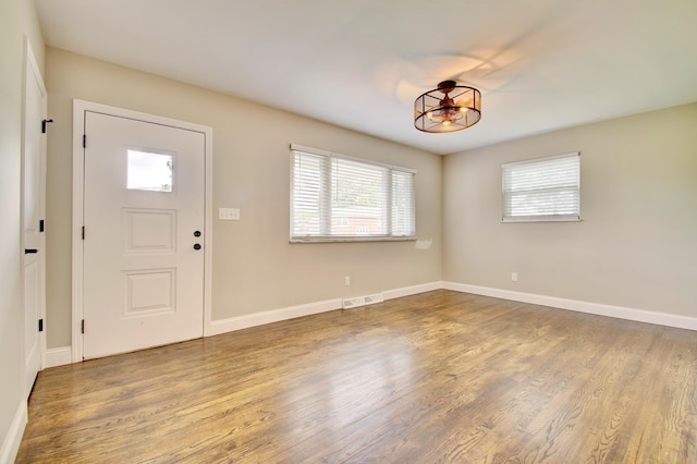 693 Peach Tree Ln, Erlanger, KY 41018 - entrance foyer featuring plenty of natural light, wood finished floors, and a chandelier