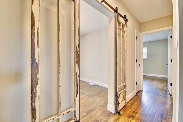 693 Peach Tree Ln, Erlanger, KY 41018 - hall featuring wood finished floors and a barn door