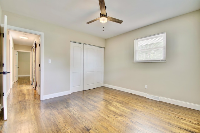 693 Peach Tree Ln, Erlanger, KY 41018 - unfurnished bedroom with wood finished floors, a closet, and ceiling fan