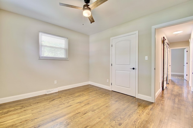 693 Peach Tree Ln, Erlanger, KY 41018 - unfurnished bedroom featuring light wood-style flooring and ceiling fan