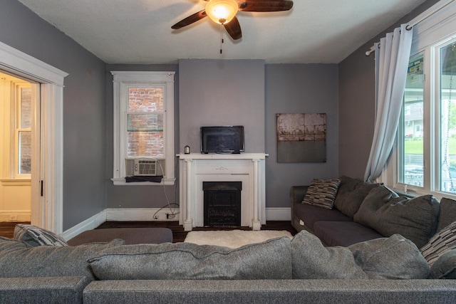 332 W 21st St, Covington, KY 41014 - living room with ceiling fan, a fireplace with flush hearth, and wood finished floors