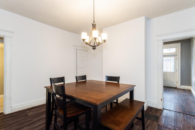 332 W 21st St, Covington, KY 41014 - dining space featuring a chandelier and dark wood-type flooring