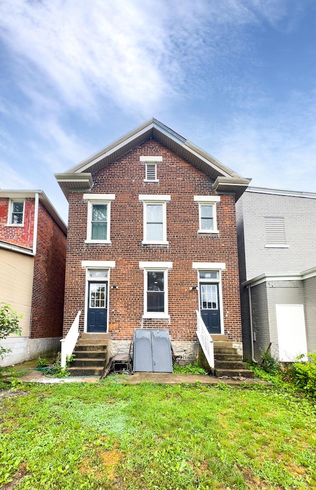 332 W 21st St, Covington, KY 41014 - view of front of home with brick siding, entry steps, and a front yard