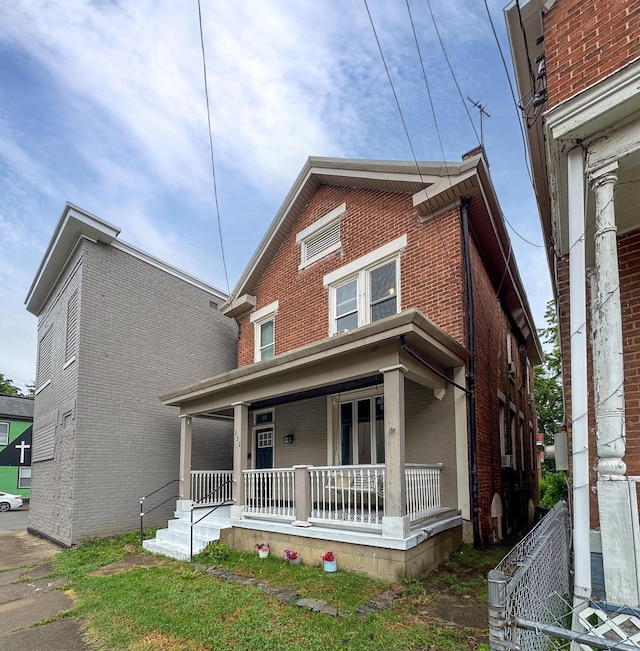 332 W 21st St, Covington, KY 41014 - view of front facade featuring a porch and brick siding