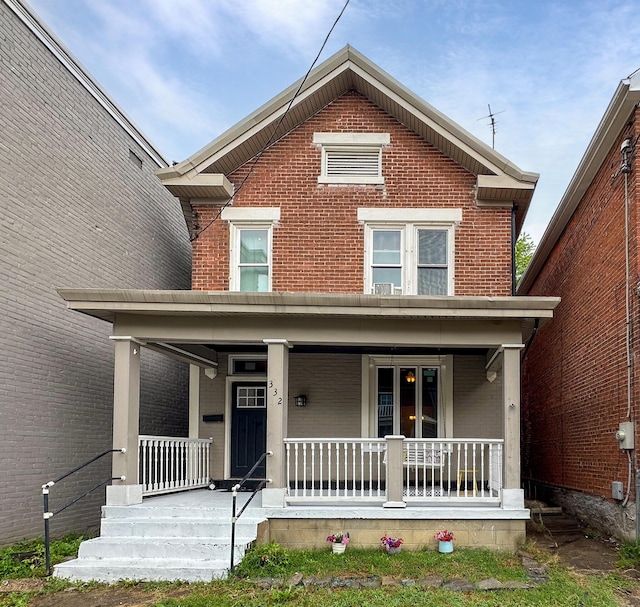 332 W 21st St, Covington, KY 41014 - view of front of property featuring a porch and brick siding